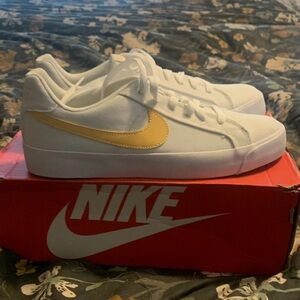 Nike White Sneakers with Yellow Swoosh